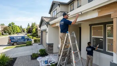 Professional house painters working on exterior home in Sacramento, CA
