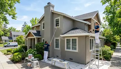 Professional house painters working on exterior home in Sacramento, CA